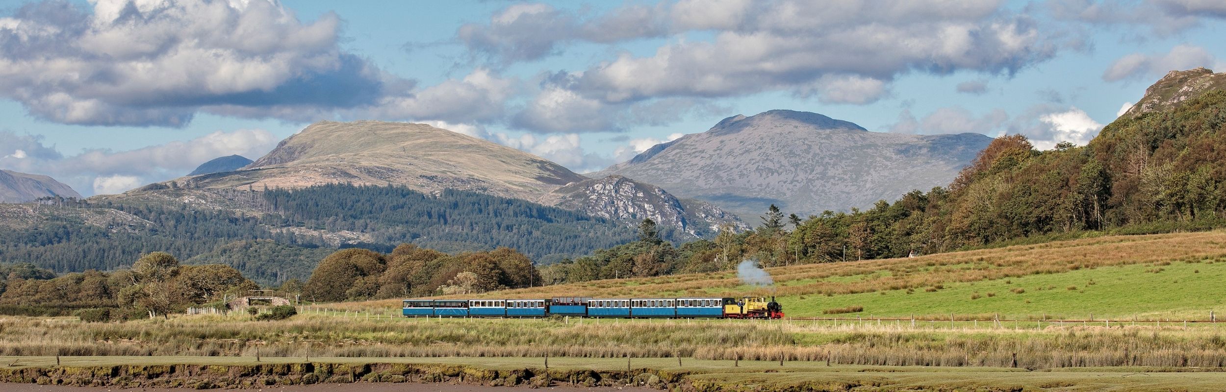 A double-header train running on the Ravenglass and Eskdale Railway