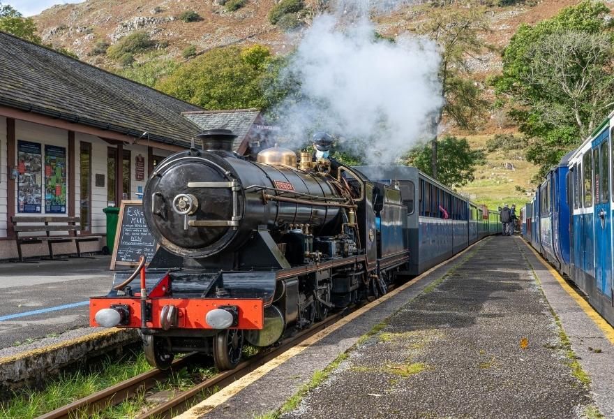Book tickets for a train journey on the Ravenglass and Eskdale railway, a heritage railway in the Lake District